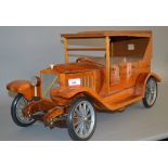 A large wooden model of a Vintage Car, approximately 80cm in length,