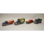 Four unboxed Tri-ang Minic clockwork tinplate vehicles,