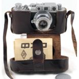 Early FED (1c1) Camera. 1938. FED 3.5/50 with lens cap, case & passport.