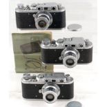 Three FED 1 Leica Copies. FED (1e1), 1942(?). FED 3.5/50, lens cap, case & manual.