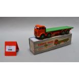 A boxed Dinky Toys 902 Flat Truck with orange cab, green flatbed and hubs,