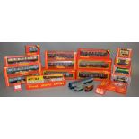 OO gauge. 18 x boxed Hornby and Triang rolling stock and coaches, with three unboxed items.