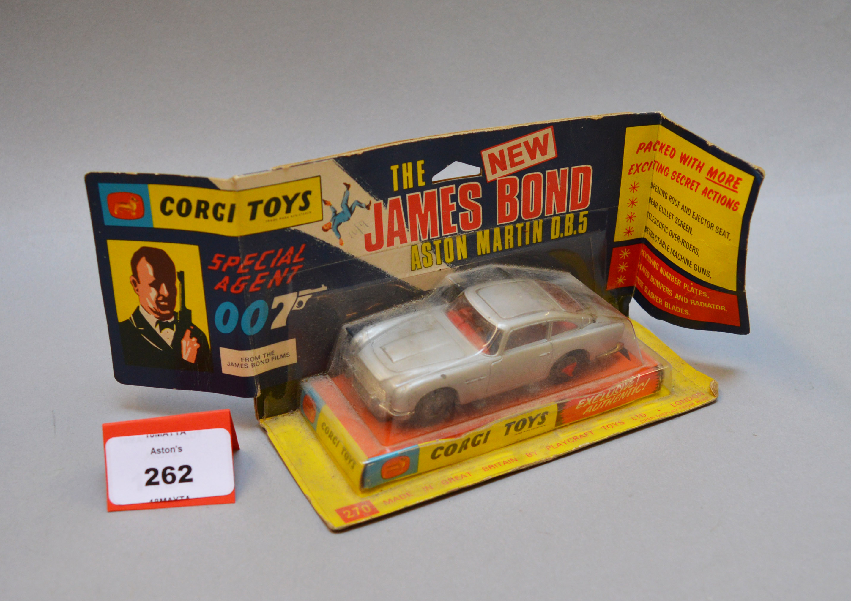 A boxed Corgi Toys 270 James Bond Aston Martin DB5 in silver with red interior and baddie figure