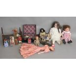 Quantity of dolls: large bisque head doll; Karola Wegerich reborn doll; four costume dolls;