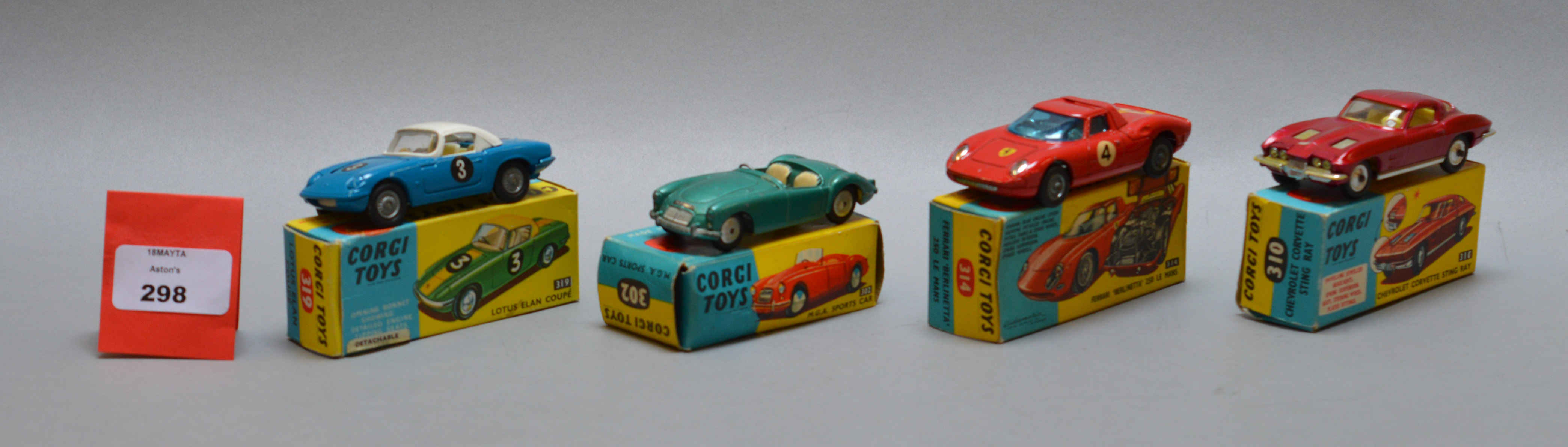 Four boxed Corgi Toys diecast model cars, 302 MGA Sports in metallic green, 310 Chevrolet Corvette,