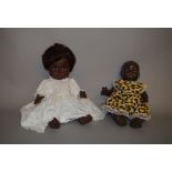 Two black dolls: Rosebud hard plastic doll; Mick Graham vinyl doll.