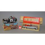 Two boxed battery operated tinplate toys,