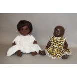 Two black dolls: Rosebud hard plastic doll; Mick Graham vinyl doll.