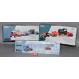 Three boxed Corgi diecast model trucks in 1:50 scale from their 'Heavy Haulage' series,