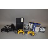 A Playstation 2 console, with power leads, four controllers and a quantity of games,