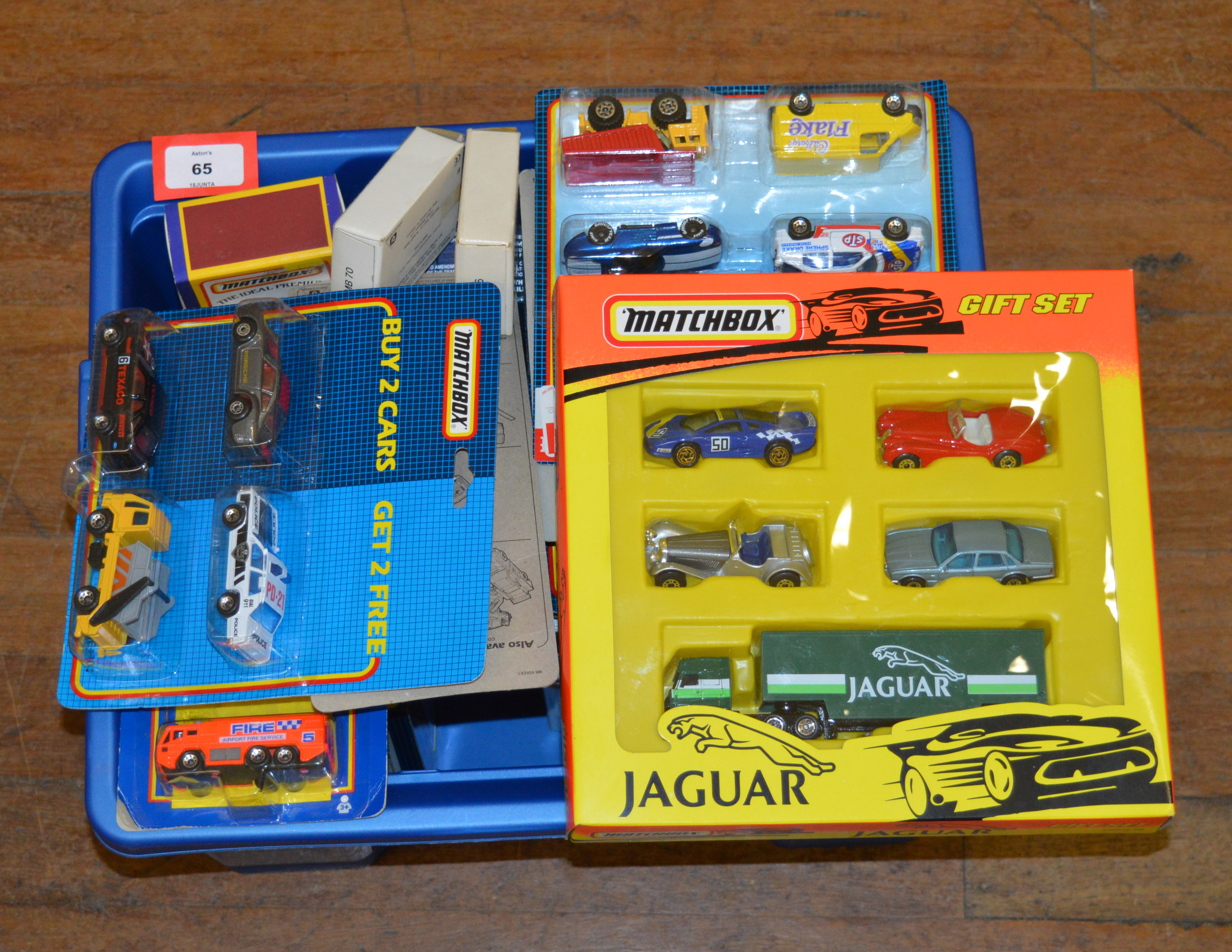 A good quantity of boxed and carded miniature diecast models by Matchbox including two and four car