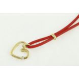 FOPE. An 18 carat H/M yellow gold diamond set heart FOPE pendent on original rubber chain.