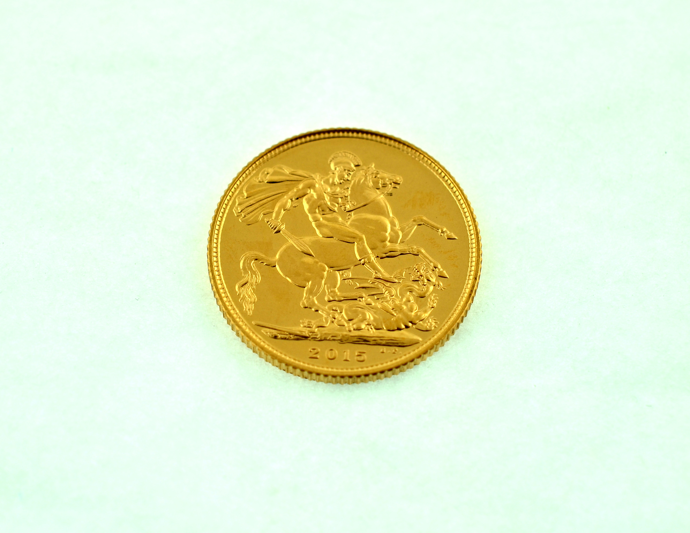 A 2015 full gold sovereign.