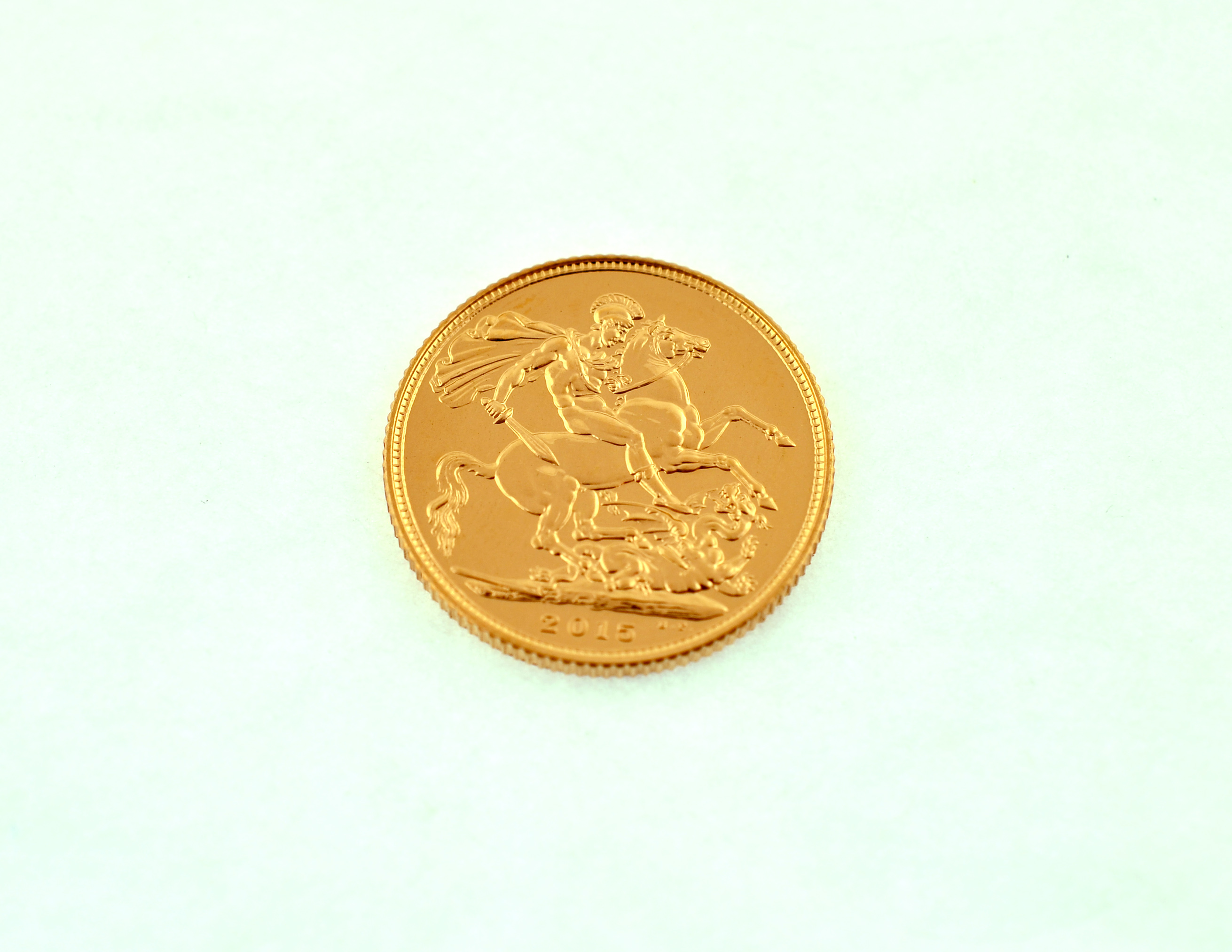 A 2015 full gold sovereign.