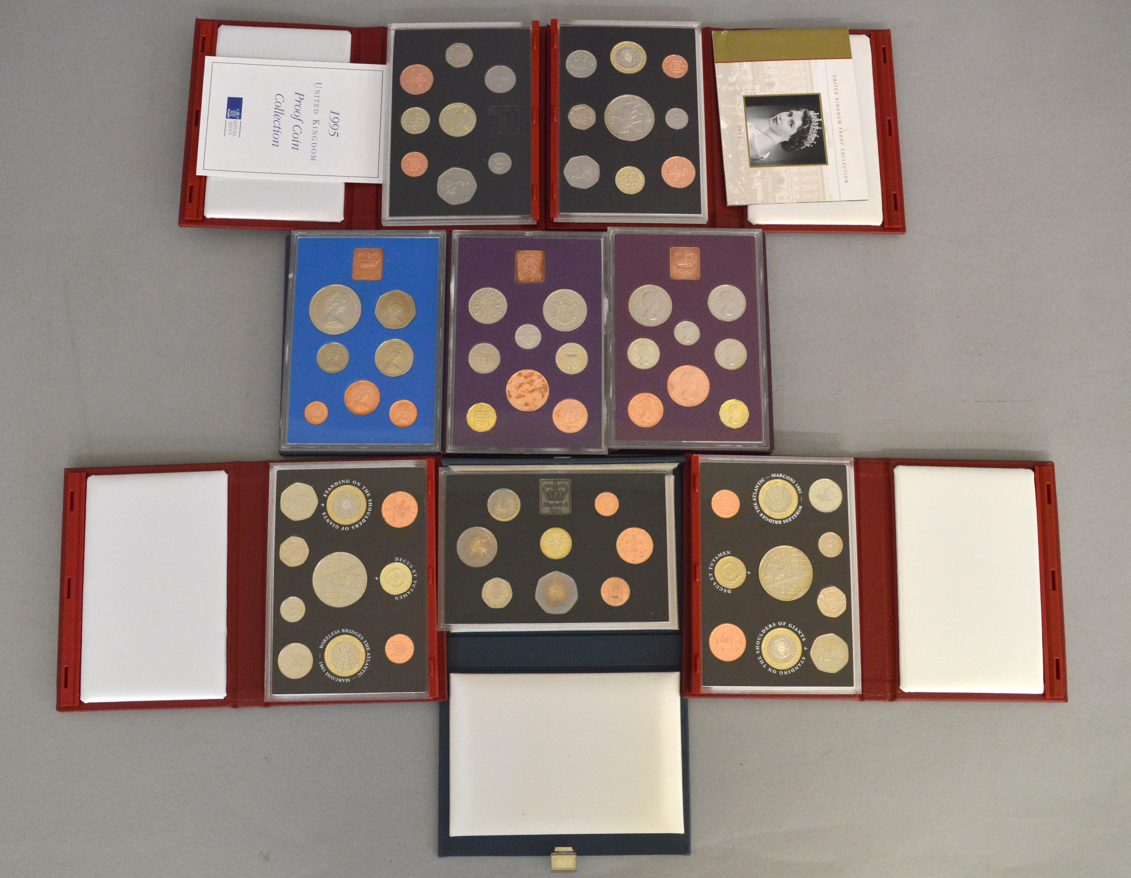 Eight Royal Mint proof coin sets (five deluxe sets)