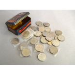 Nineteen £5 coins together with a quantity of commemorative coins.