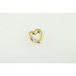 An 18ct H/M diamond set heart pendant, approx diamond weight 0.25ct, approx 3.