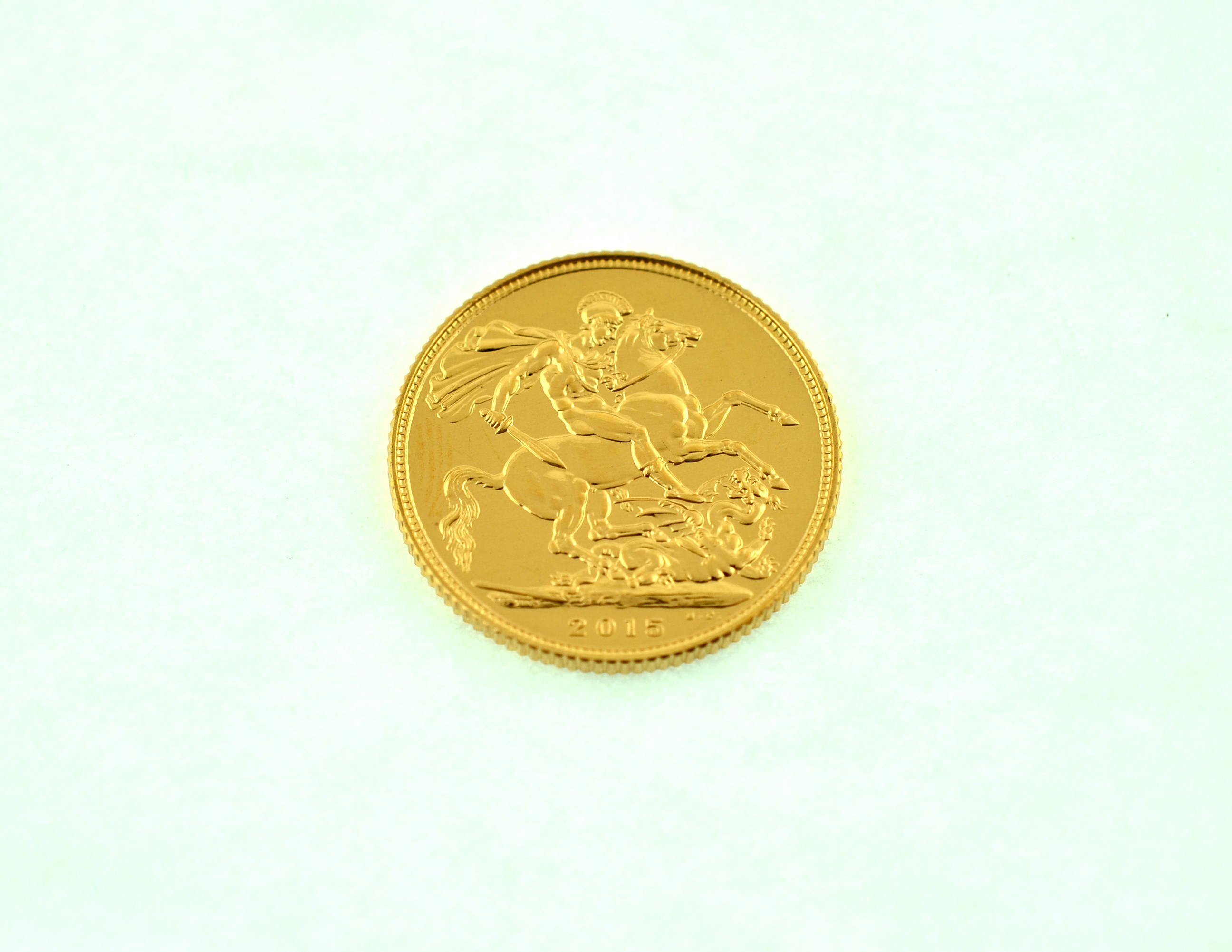 A 2015 full gold sovereign.