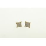 A pair of 9ct diamond set earrings with screw-back fittings, approx total diamond weight 0.