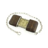 A 1920's MOVADO Ermeto vest watch with leather covered case, working,
