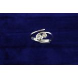 An 18ct H/M 2-stone Diamond twist set ring, approx total weight 0.50ct, size O, approx 5.