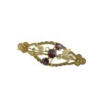 An Edwardian almandine garnet brooch, stamped GOLD, approx 1.