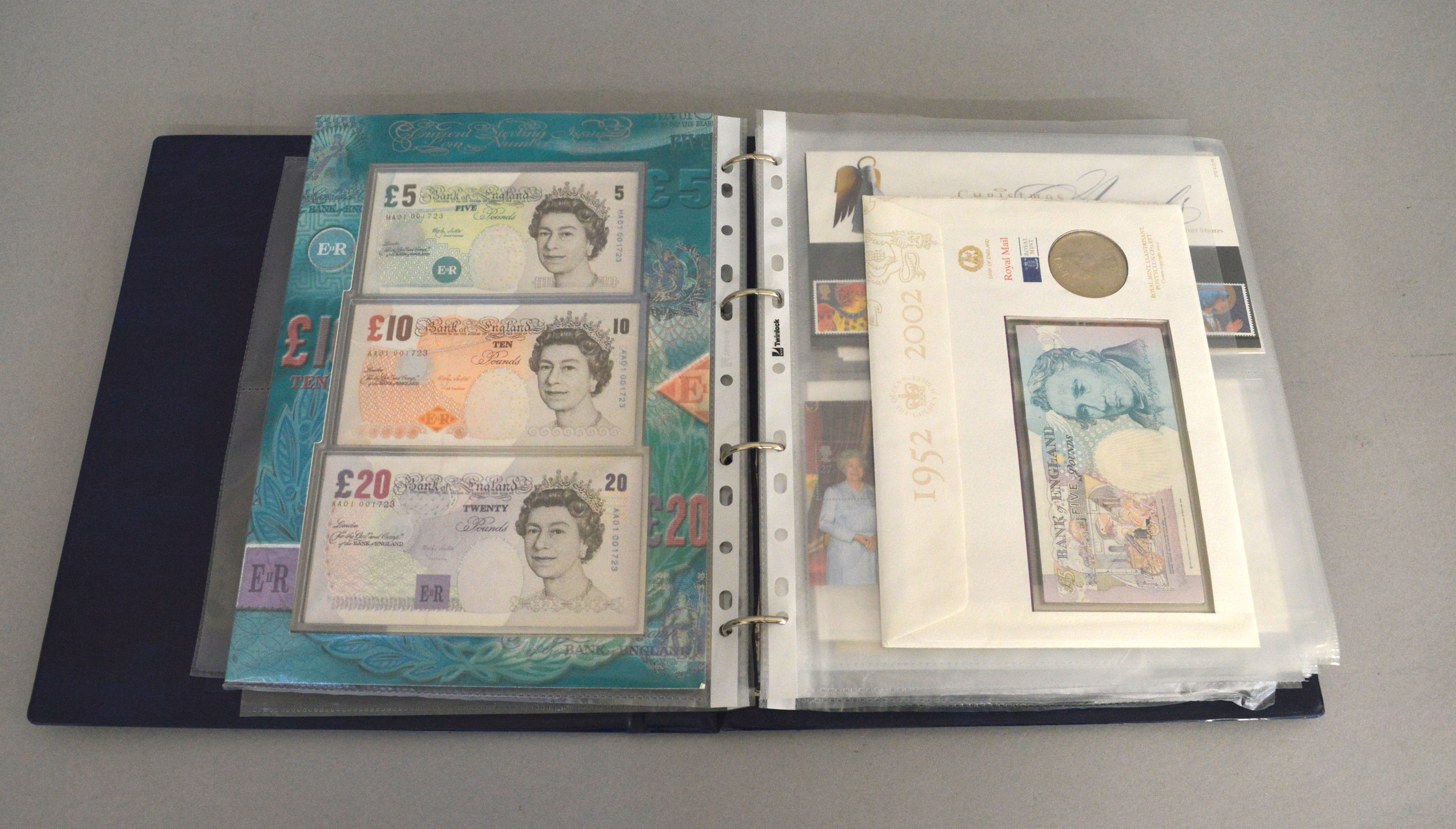 A folder to include a quantity of modern coins, notes & medallions,