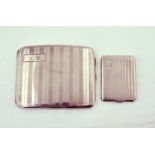 A silver cigarette case with a silver notebook cover, both H/M,