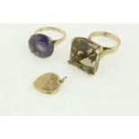 Two large gems set rings, both stamped 14 K, approx.