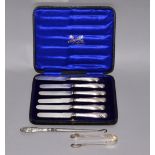 A cased set of six silver handled dessert knives,