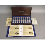 A complete boxed set of "The Beauty of Britain's Churches" silver proof quality medals,