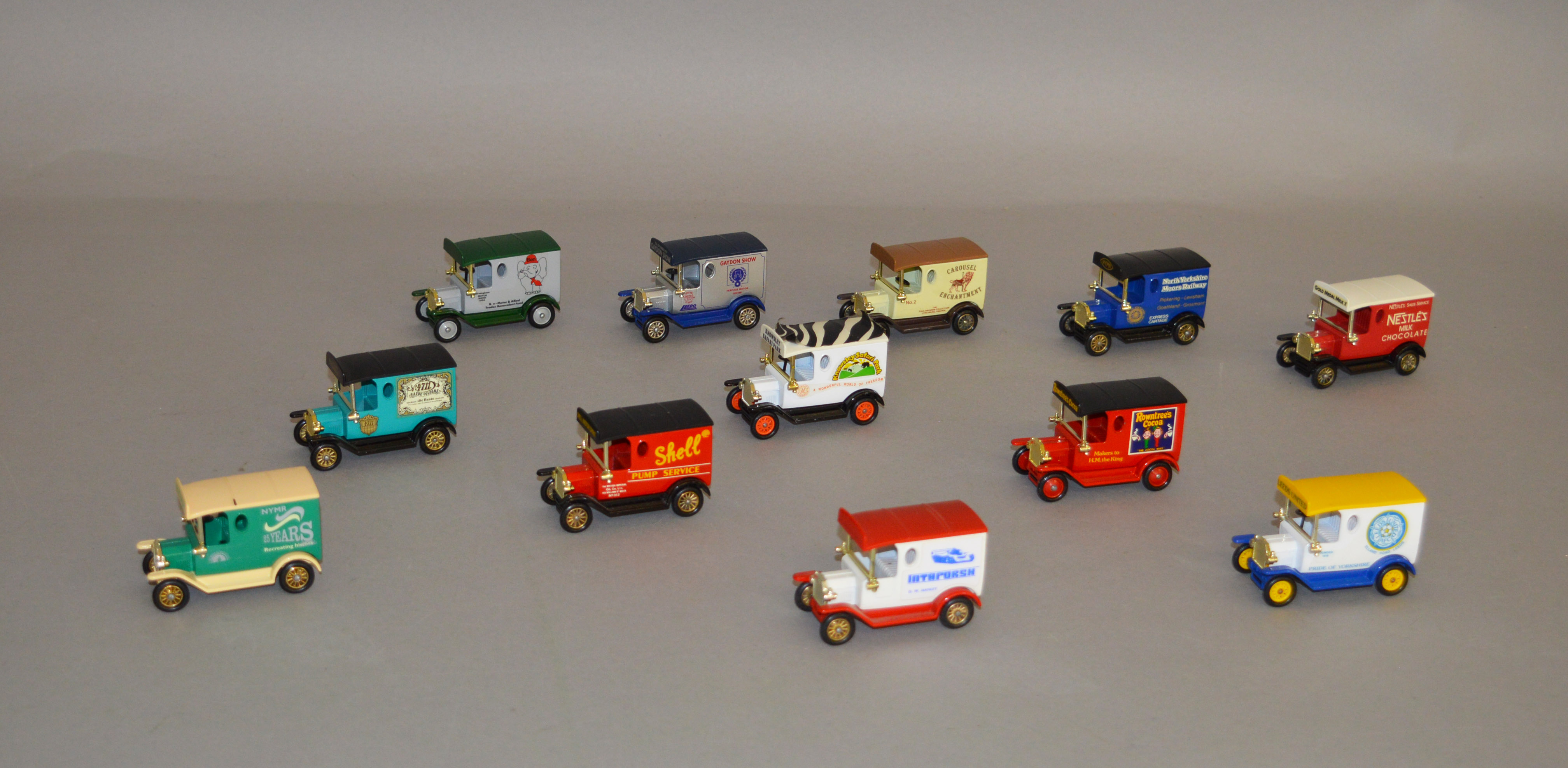 Twelve unboxed Lledo pre-production metal and plastic DG6 Model T Ford Van models,