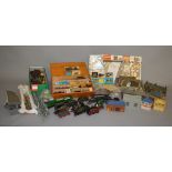 A wooden box containing Hornby Dublo switches and buffers and a quantity of small parts and