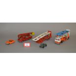 A small group of unboxed diecast models by Corgi and Dinky including a Corgi 345 MGC GT model in