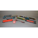 OO gauge. Five unboxed Lima diesel locomotives, with five items of rolling stock. Overall appear G.