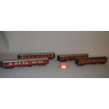 O Gauge. Four kit built LMS Railway Carriages in maroon.