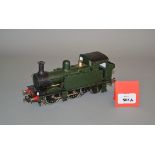 O Gauge. An electric kit-built 0-4-2 Pannier Tank locomotive in green.