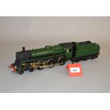 O Gauge. An electric kit-built 4-6-0 locomotive and tender in green.