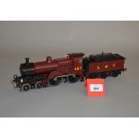 O Gauge. An electric kit-built 4-4-0 LMS locomotive and tender '487' in red/black.