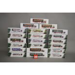 Twenty one boxed Eddie Stobart diecast truck models in 1:76 scale produced by Atlas Editions,