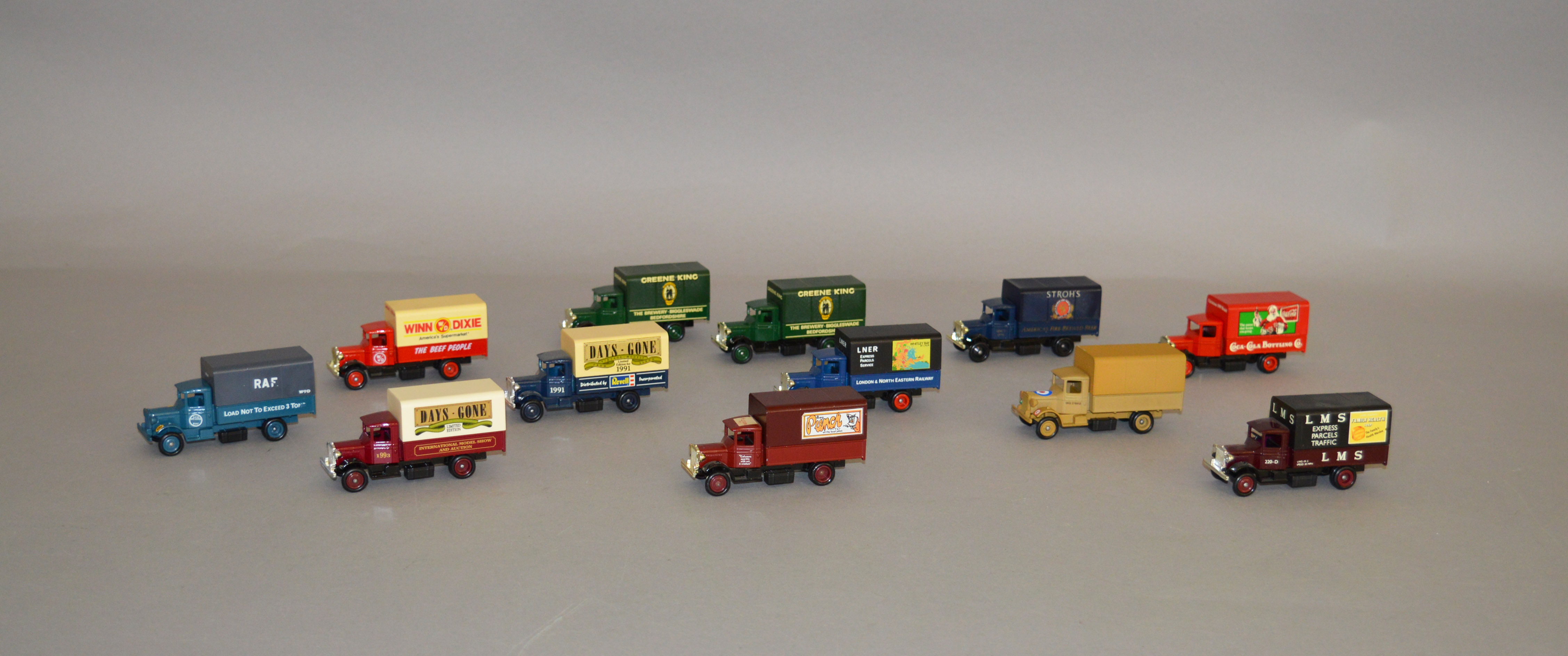 Twelve unboxed Lledo pre-production metal and plastic DG28 Mack Canvas-Back Truck models,