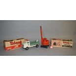 Two Triang toys: Jones KL 44 Crane; Milk Lorry, with roof sign and one milk bottle.