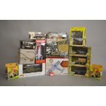 A mixed group of boxed diecast models including a number of military items, tanks, vehicles,