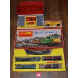OO gauge. Three Triang/Hornby items: The Freightmaster set; R81 Station Set; R348 Giraffe Car Set.