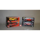 Four boxed Hot Wheels diecast models in 1:18 scale, a #56293 Enzo Ferrari,