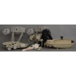 Five Kenner Star Wars vehicles: two AT-AT; Millennium Falcon; Rebel Transport; X-wing.