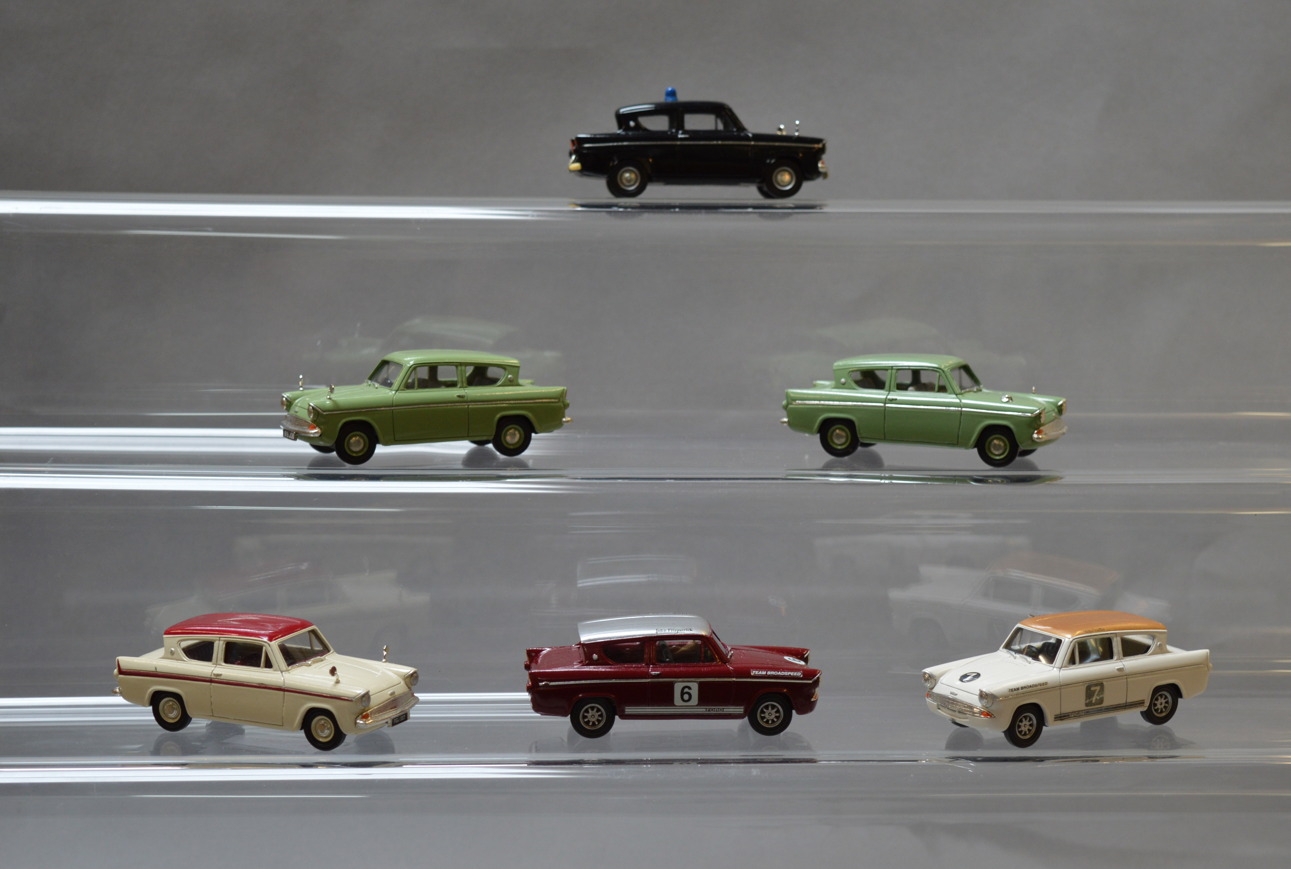Six unboxed Lledo pre-production prototype Vanguards Ford Anglia resin car models,