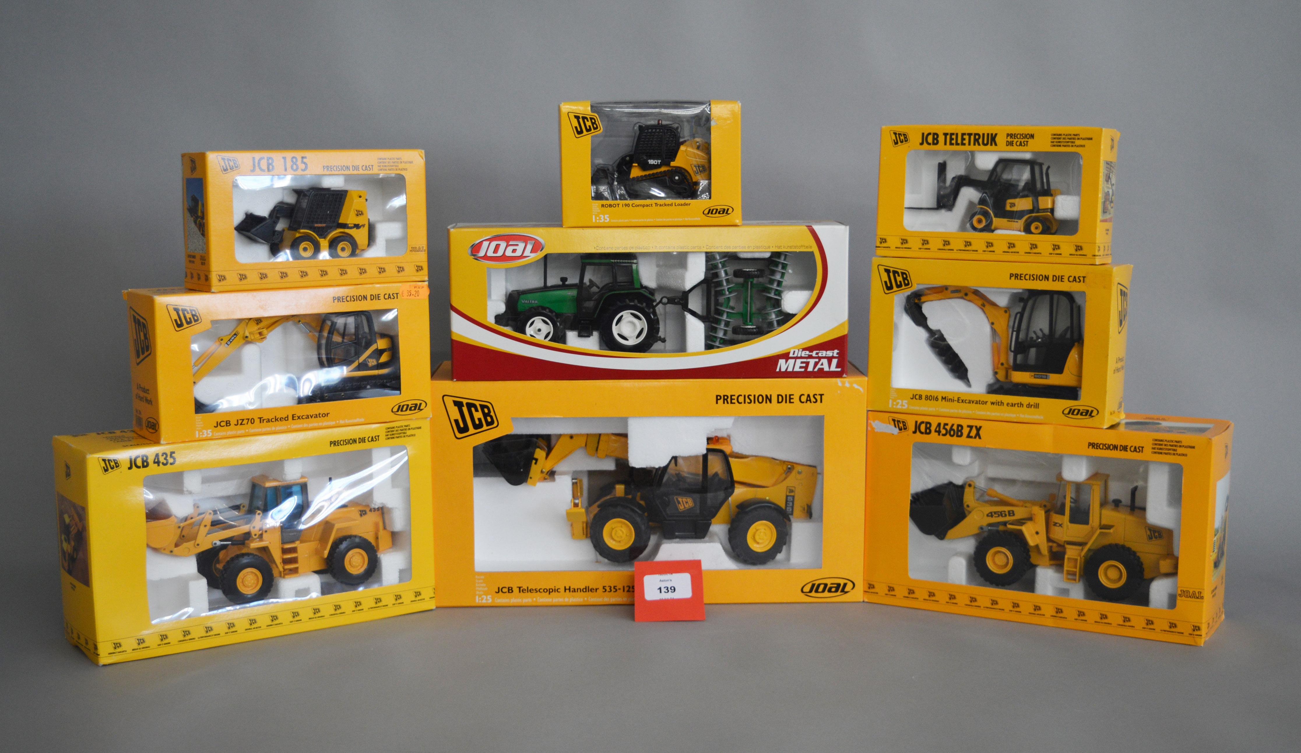 Eight Joal JCB diecast construction models, together with a Joal 255 Valtra tractor.