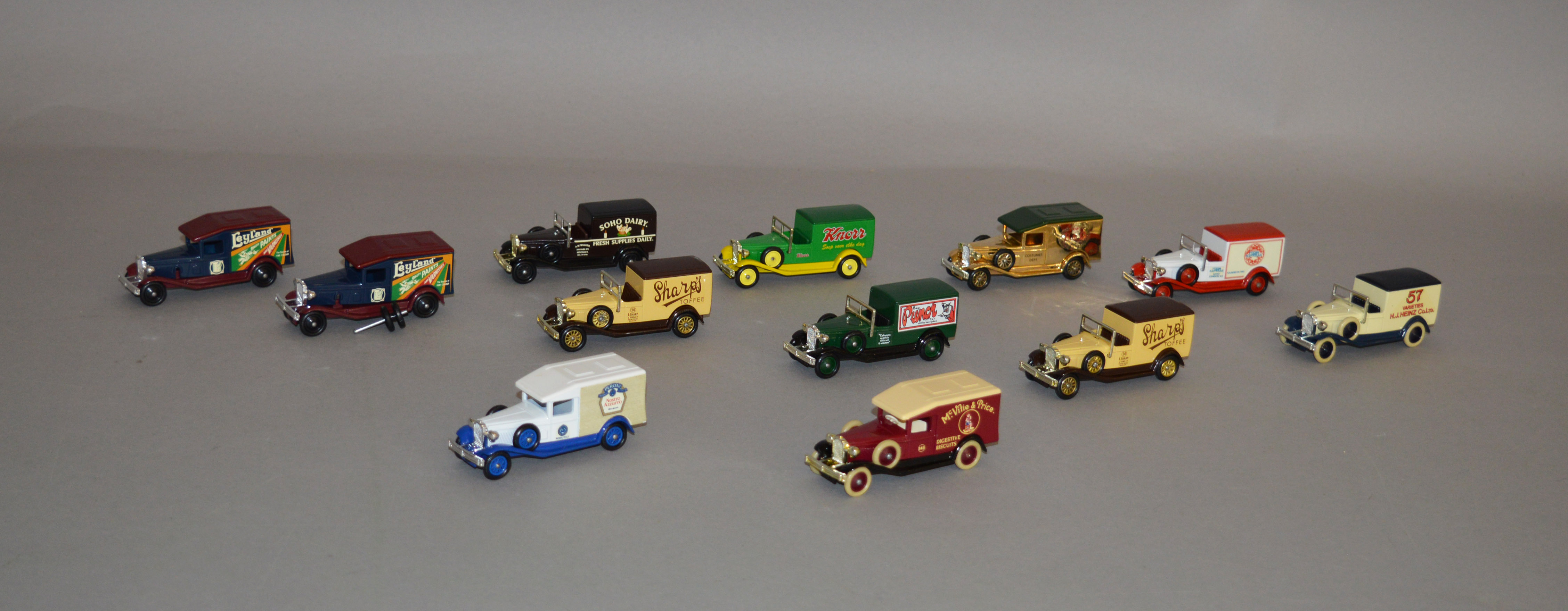 Twelve unboxed Lledo pre-production metal and plastic Packard Delivery Van models,