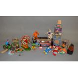 A mixed lot of tinplate, plastic and other toys, both boxed and unboxed,